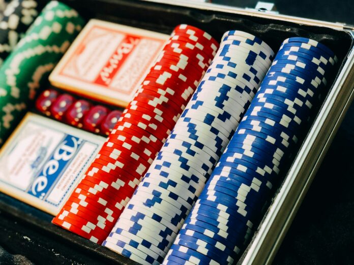 Photo by Chris Liverani closeup photography of poker chip set