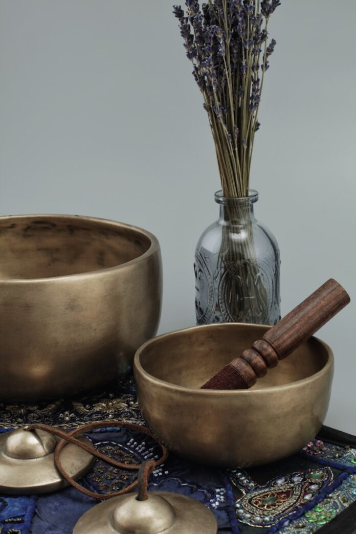Photo by Magic Bowls brown wooden mortar and pestle