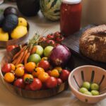 만성피로, 일상 속 실천으로 극복… 최신 건강 트렌드와 실생활 팁 Fresh produce including tomatoes, carrots, and avocados on a counter.