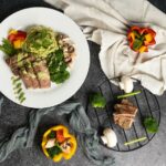 “나만의 균형 식단, 어렵지 않아요…최근 트렌드에서 배우는 똑똑한 실천법” a white plate topped with meat and veggies