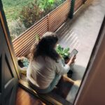 “지친 일상, 만성피로 탈출법 찾기”…작은 변화가 만드는 큰 활력 Woman sitting on balcony with smartphone