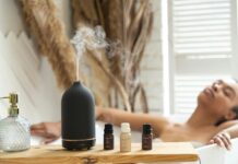 일상 속 대체요법, 작은 실천이 건강을 바꾼다 a woman laying in a bathtub next to a bottle of essential oils